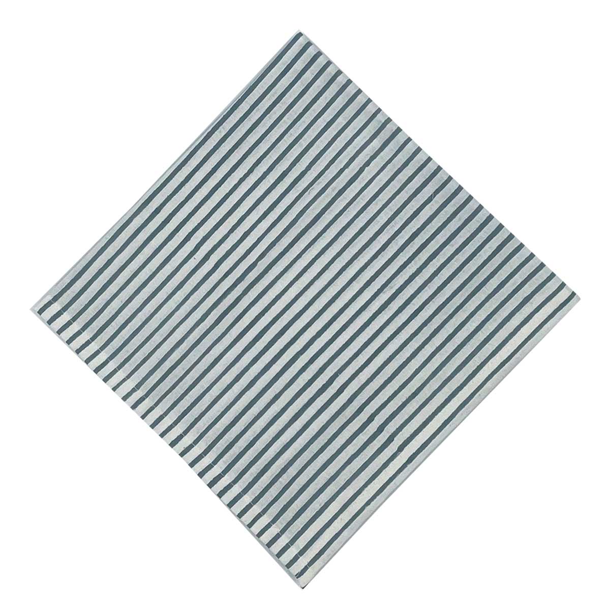 A striped blockprint napkin with French blue color scheme on a white background.