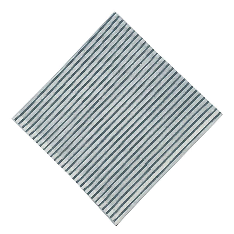 A striped blockprint napkin with French blue color scheme on a white background.
