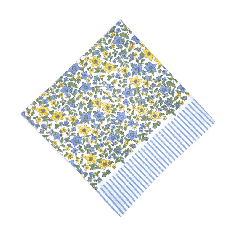 Floral patterned fabric with blue and yellow flowers on a white background