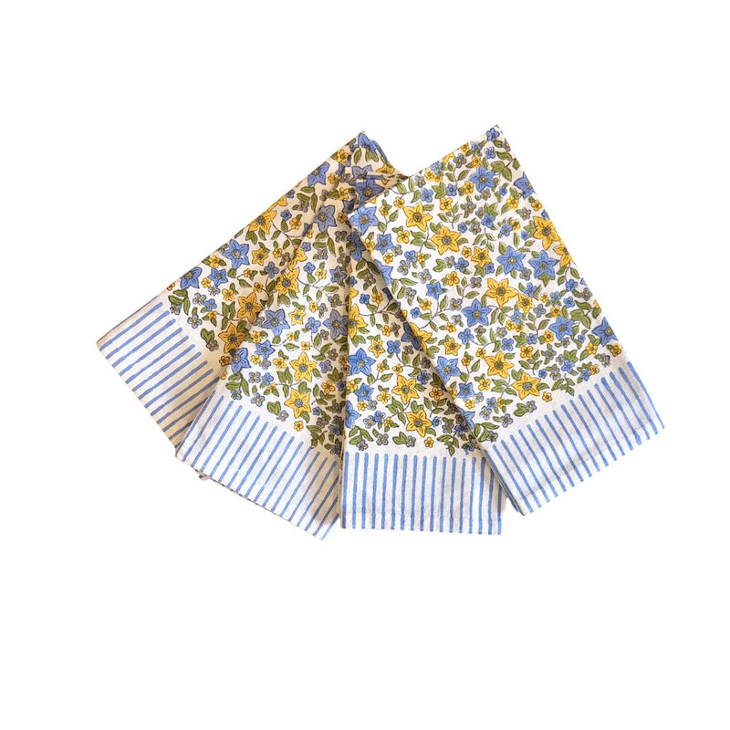 Folded fabric with floral and striped patterns on a white background