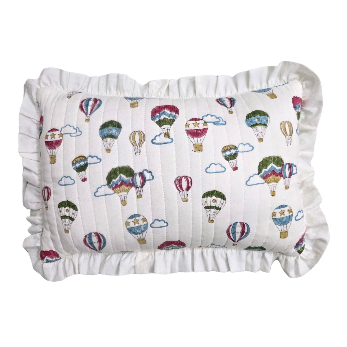 A square white pillow with a ruffled border, featuring an all-over print of colorful hot air balloons and clouds.